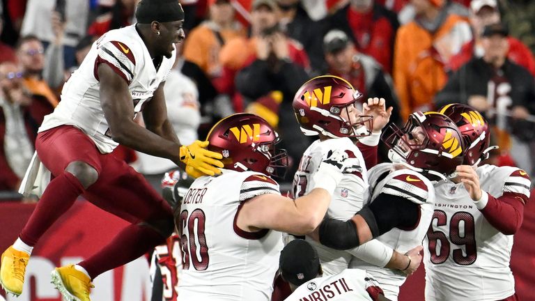 Washington Commanders kicker Zane Gonzalez (center) during the second half of an NFL wild card playoff football game against the Tampa Bay Buccaneers on Sunday, Jan. 12, in Tampa, Fla. After scoring the winning goal, he was congratulated by his teammates. 2025. (AP Photo/Jason Behnken)