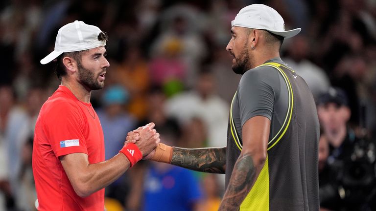 Nick Kyrgios, right, of Australia congratulates Jacob Fearnley of Britain following their first round match at the Australian Open tennis championship in Melbourne, Australia, Monday, Jan. 13, 2025. (AP Photo/Ng Han Guan)