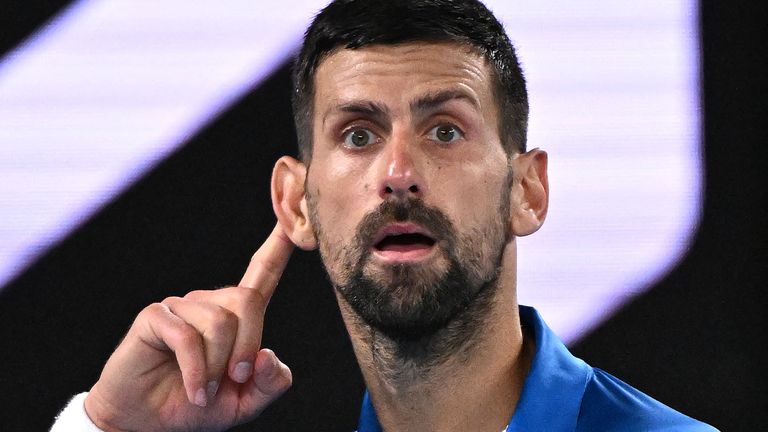Serbia's Novak Djokovic reacts to a point against Spain's Carlos Alcaraz during their men's singles quarterfinal match on day ten of the Australian Open tennis tournament in Melbourne on January 21, 2025. (Photo by WILLIAM WEST / AFP) / -- IMAGE RESTRICTED TO EDITORIAL USE - STRICTLY NO COMMERCIAL USE --