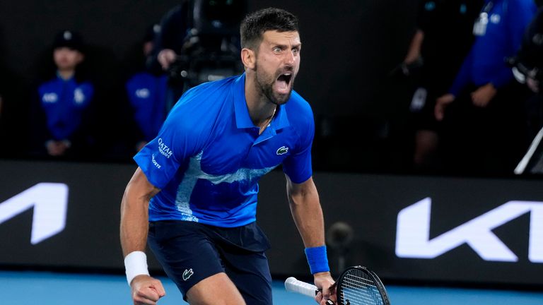 Novak Djokovic of Serbia celebrates after defeating Carlos Alcaraz of Spain in their quarterfinal match at the Australian Open tennis championship in Melbourne, Australia, Wednesday, Jan. 22, 2025. (AP Photo/Asanka Brendon Ratnayake)