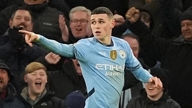 Phil Foden celebrates after putting Man City 4-0 up