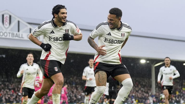 Fulham's Raul Jimenez (left) celebrates after scoring his sides first goal from the penalty spot