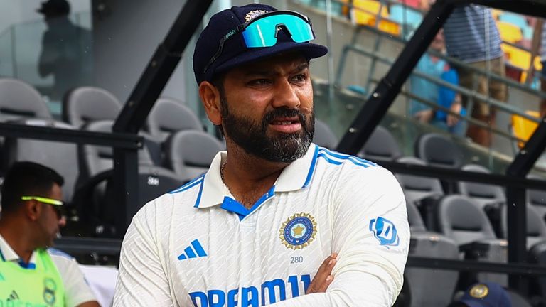 India's captain Rohit Sharma waits for play to start on day three of the third cricket test between India and Australia at the Gabba in Brisbane, Australia, Monday, Dec. 16, 2024. (AP Photo/Pat Hoelscher)