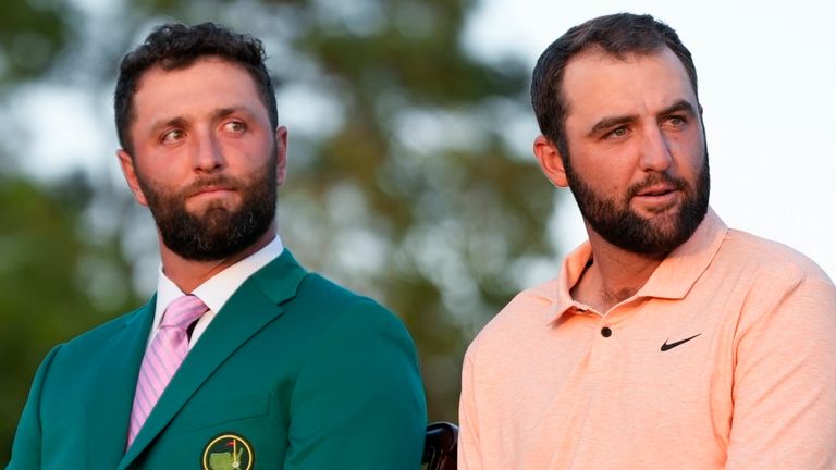 Scottie Scheffler sits with Jon Rahm, of Spain, at the green jacket ceremony after winning the Masters golf tournament at Augusta National Golf Club Sunday, April 14, 2024, in Augusta, Ga. . (AP Photo/Matt Slocum) 