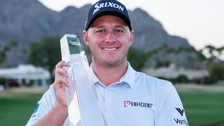 Sepp Straka holds the trophy after winning the American Express golf tournament in La Quinta, Calif., Sunday, Jan. 19, 2025. (AP Photo/William Liang)