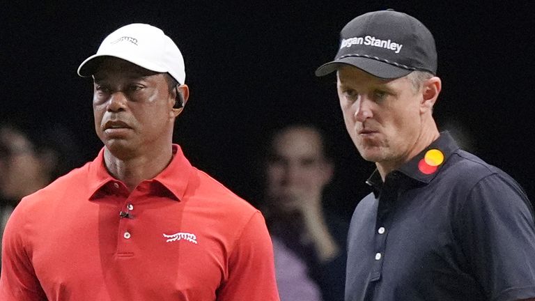 Tiger Woods of the Jupiter Links Golf Club watches his shot on the 10 green as Justin Rose of the Los Angeles Golf Club prepared to line his putt, Tuesday, Jan. 14, 2025, in Palm Beach Gardens, Fla. (AP Photo/Marta  Lavandier)