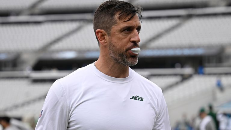 New York Jets quarterback Aaron Rodgers leaves the field after warming up before an NFL football game against the Jacksonville Jaguars