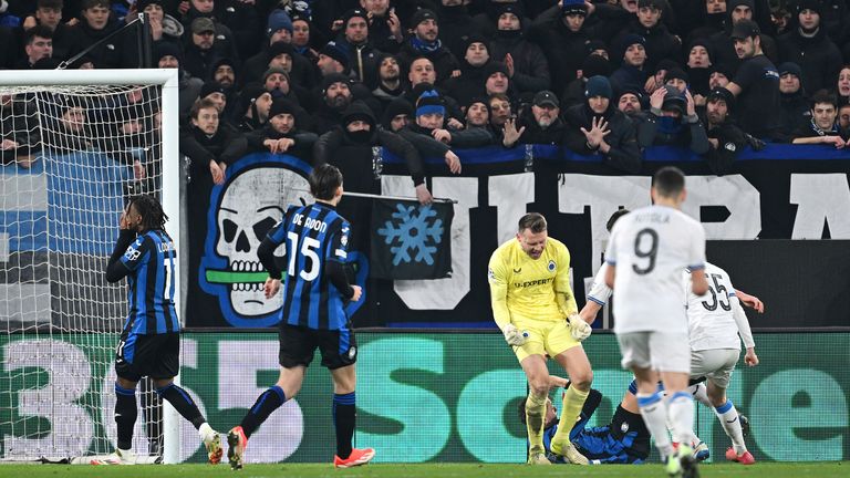 Club Brugge goalkeeper Simon Mignolet celebrates after saving a penalty from Atalanta's Ademola Lookman