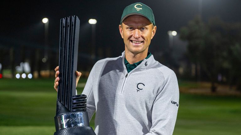 First place individual champion Adrian Meronk of Cleeks GC poses with the trophy on the 18th green after the final round of LIV Golf Riyadh at Riyadh Golf Club on Saturday, February 08, 2025 in Riyadh, Saudi Arabia. (Photo by Montana Pritchard/LIV Golf via AP)