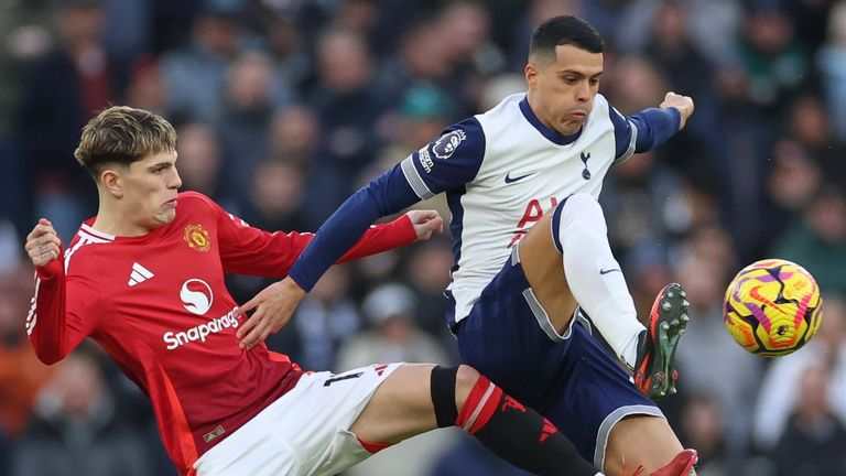 Alejandro Garnacho challenges Pedro Porro for possession (AP Photo/Ian Walton)