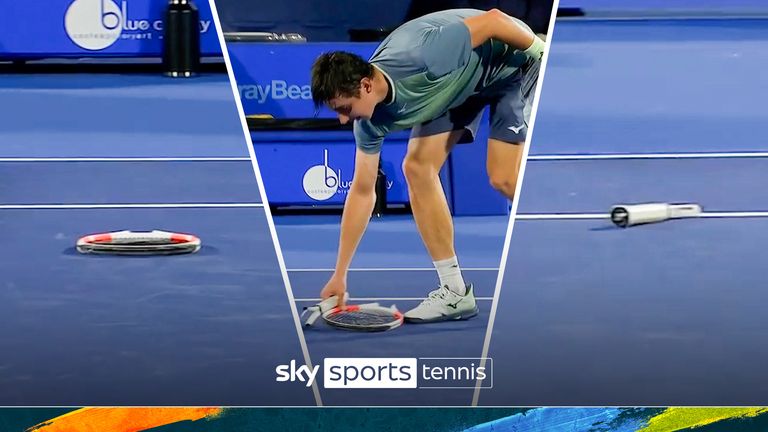 Alexander Shevchenko goes to serve but is held back after his racket snapped in half during the clash against Michael Mmoh at Delray Beach