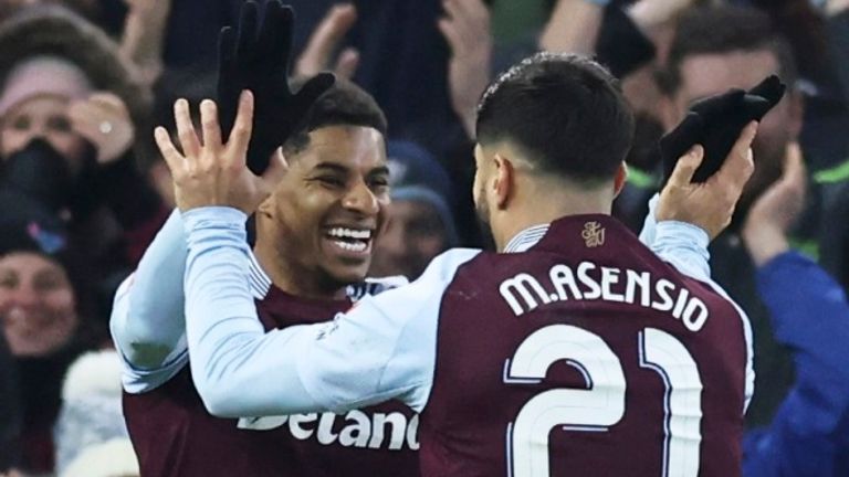 Aston Villa's Marco Asensio, centre, celebrates after scoring the opening goal with Marcus Rashford during the English FA Cup fifth round soccer match between Aston Villa and Cardiff City at the Villa Park stadium in Birmingham, England, Friday, Feb. 28, 2025. (AP Photo/Darren Staples)