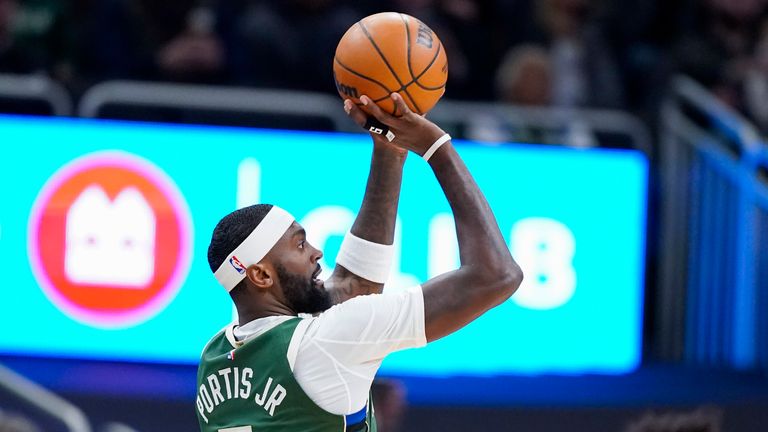 Milwaukee Bucks' Bobby Portis Jr. (9) against the Philadelphia 76ers during the first half of an NBA basketball game Sunday, Feb. 9, 2025, in Milwaukee. (AP Photo/Andy Manis)