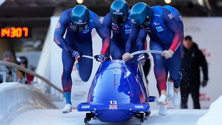 Brad Hall, Taylor Lawrence, Leon Greenwood and Greg Cackett, of Great Britain, start their first run in the 4-man bobsleigh at the Bobsleigh World Cup in Innsbruck, Austria, Sunday, Jan. 19, 2025. (AP Photo/Matthias Schrader)