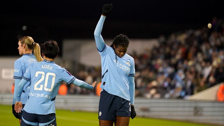 Bunny Shaw raises her fist and bows her head after scoring Man City's first goal against Liverpool