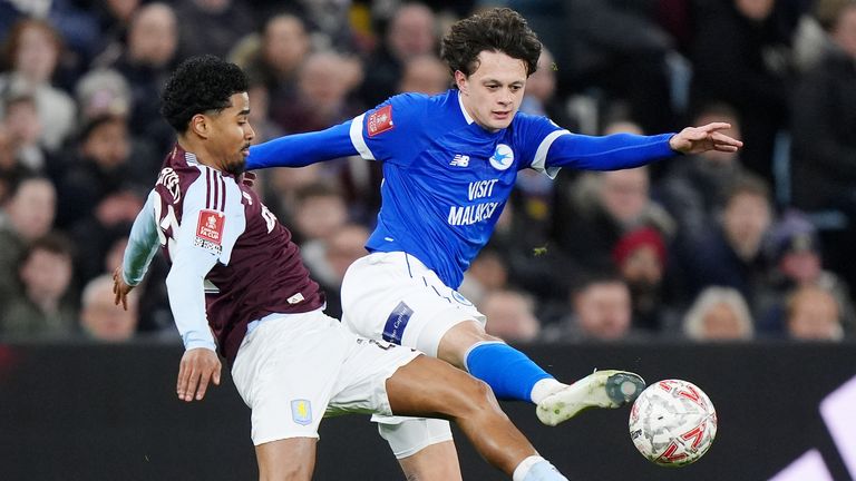 Cardiff City's Perry Ng and Aston Villa's Ian Maatsen battle for the ball