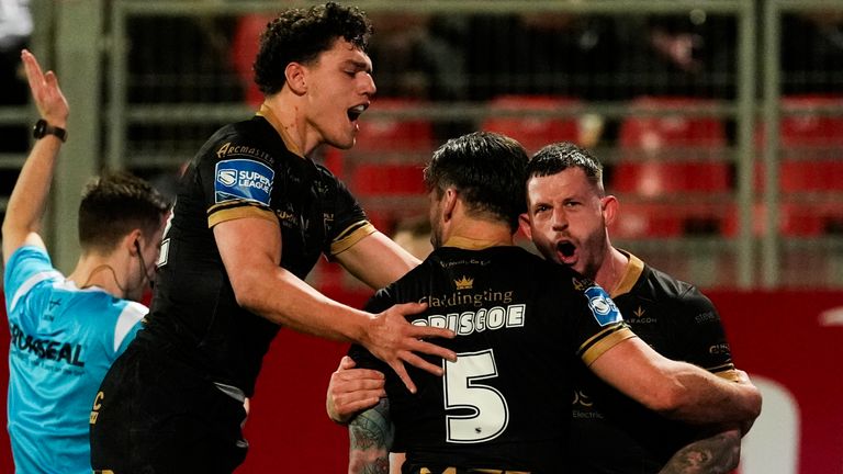Picture by Olly Hassell/SWpix.com - 14/02/2025 - Rugby League - Betfred Super League Round 1 - Catalans Dragons v Hull FC - Stade Gilbert Brutus, Perpignan, France - Tom Briscoe of Hull FC celebrating his try with Cade Cust of Hull FC