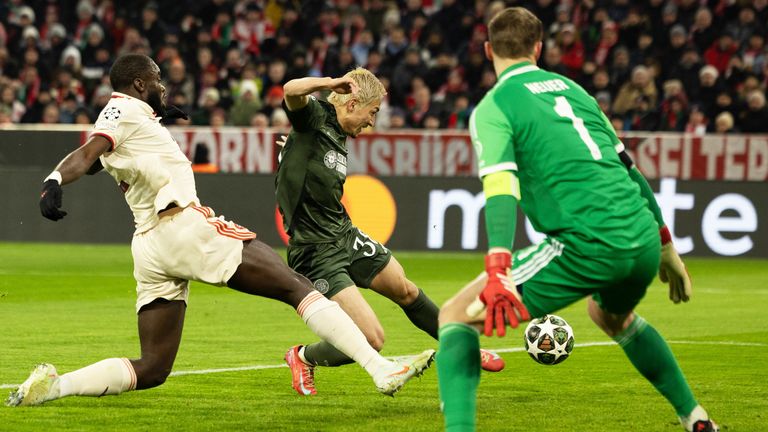 MUNICH, GERMANY - FEBRUARY 18: Celtic...s Daizen Maeda goes close under pressure from Bayern Munich's Dayot Upamecano during the UEFA Champions League 2024/25 League Knockout Play-off second leg match between FC Bayern Munich and Celtic at the Allianz Arena, on February 18, 2025, in Munich, Germany. (Photo by Craig Foy / SNS Group)