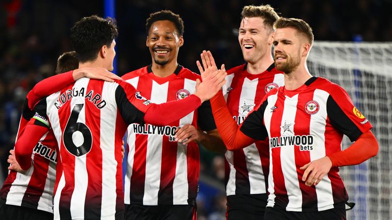 Christian Norgaard of Brentford celebrates scoring his team's third goal at Leicester with team-mates