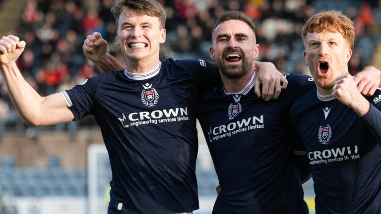 Dundee, Scotland - February 08: Dundee's Clark Robertson (Middle) celebrates the score to make it 1-0 during a Scottish Cup of Scottish Gas's Scottish Cup between Dundee and AirDrieonians at Scott Foam Stadium in Dens Park, in the February 08, 2025, in Dundee, Scotland. (Photo by Mark Scates / SNS team)