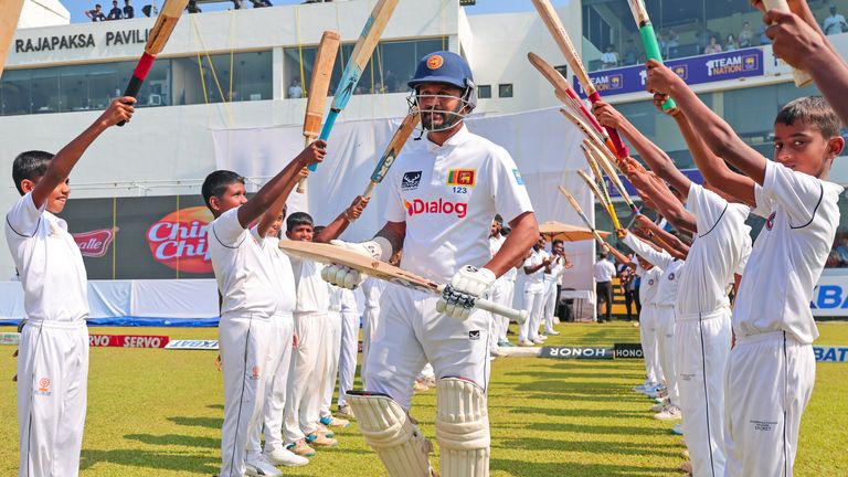 Sri Lanka's Dimuth Karunaratne who is playing his career last test match arrives to bat during the first day of the second test cricket match between Sri Lanka and Australia in Galle, Sri Lanka, Thursday, Feb. 6, 2025. (AP Photo/Lahiru Harshana) 