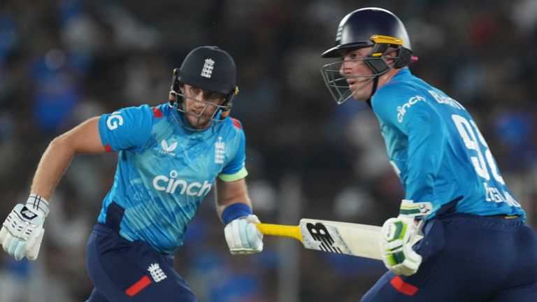 England's Joe Root, left, and Tom Banton run between the wickets during the third one day international cricket match between India and England in Ahmedabad, India, Wednesday, Feb. 12, 2025. (AP Photo/ Ajit Solanki )