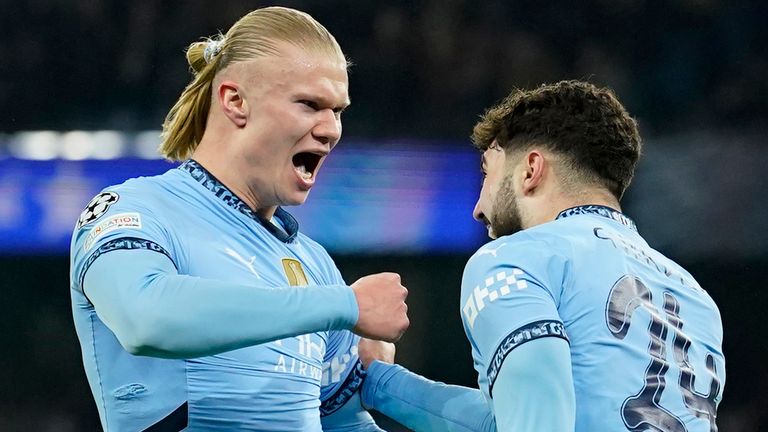 Manchester City's Erling Haaland, left, celebrates with Manchester City's Josko Gvardiol after scoring his sides first goal during the Champions League playoff first leg soccer match between Manchester City and Real Madrid at the Etihad Stadium in Manchester, England, Tuesday, Feb. 11, 2025. (AP Photo/Dave Thompson)