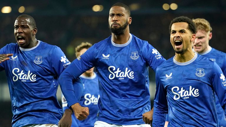 Everton's Beto, centre, celebrates with teammates after scoring his side's opening goal during the English Premier League soccer match between Everton and Liverpool, Liverpool, England, Wednesday, Feb.12, 2025. (AP Photo/Dave Thompson)