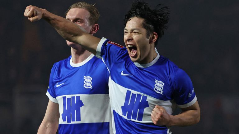 Tomoki Iwata celebrates after firing home a stunning equaliser against Newcastle