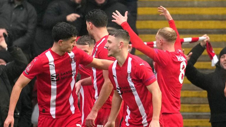 Leyton Orient players celebrate after taking the lead against Manchester City via a Stefan Ortega own goal