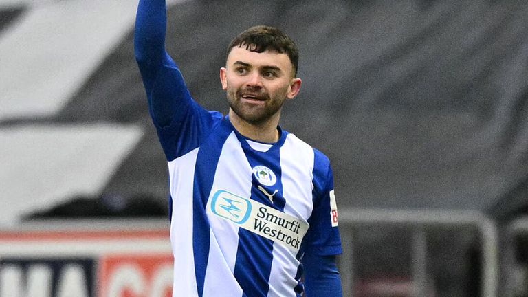 Jonny Smith celebrates after scoring a stunning equaliser for Wigan against Fulham