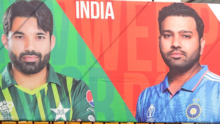 A billboard depicts Indian captain Rohit Sharma (R) beside his Pakistan's counterpart Mohammad Rizwan (L) 