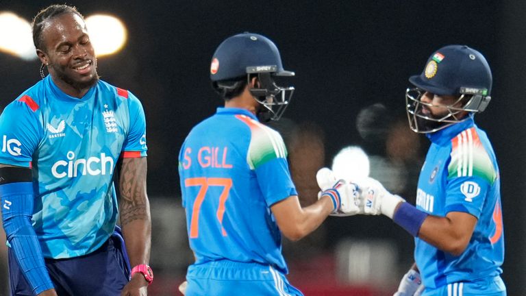 England's Jofra Archer, left, reacts as India's Shreyas Iyer, right, and Shubman Gill celebrate scoring runs during the first one day international cricket match between India and England at Vidarbha Stadium in Nagpur, India, Thursday, Feb. 6, 2025. (AP Photo/Aijaz Rahi) 