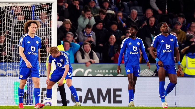 Leicester fans look dejected as Brentford race into a 3-0 half-time lead