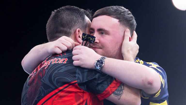 Luke Littler embraces Jonny Clayton after their quarter-final in Milton Keynes (pic; PDC)