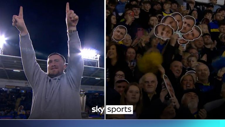 Littler receives a huge welcome as he walks out in front of the fans at Warrington