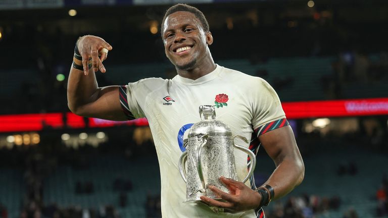 England's Maro Itoje celebrates with the Calcutta Cup after winning the Six Nations rugby union match between England and Scotland at Twickenham in London, Saturday, Feb. 22, 2025. (AP Photo/Ian Walton)