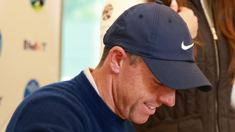 PEBBLE BEACH, CA - FEBRUARY 02: PGA golfer Rory McIlroy autographs hole number 18 pin flags after winning the AT&T Pebble Beach Pro AM on February 2, 2025, at Pebble Beach Golf Links in Pebble Beach, California. (Photo by Brian Spurlock/Icon Sportswire) (Icon Sportswire via AP Images) 