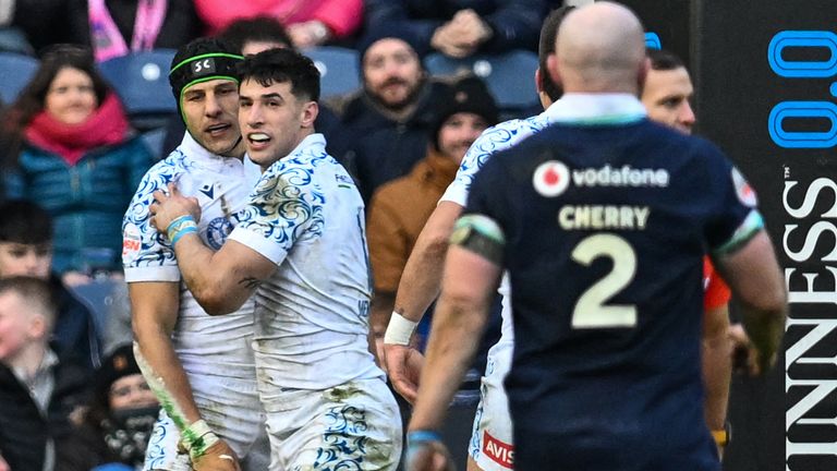 Italy's centre Juan Ignacio Brex (C-L) celebrates after scoring a try during the Six Nations international rugby union match between Scotland and Italy at Murrayfield Stadium in Edinburgh, Scotland on February 1, 2025. (Photo by ANDY BUCHANAN / AFP)