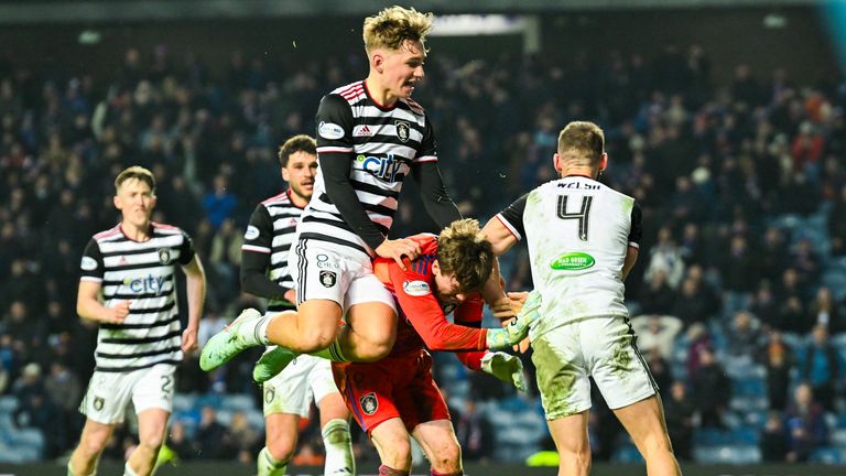 Queen's Park's Adam Montgomery and Sean Welsh celebrate with goalkeeper Calum Ferrie after he saves a James Tavernier penalty