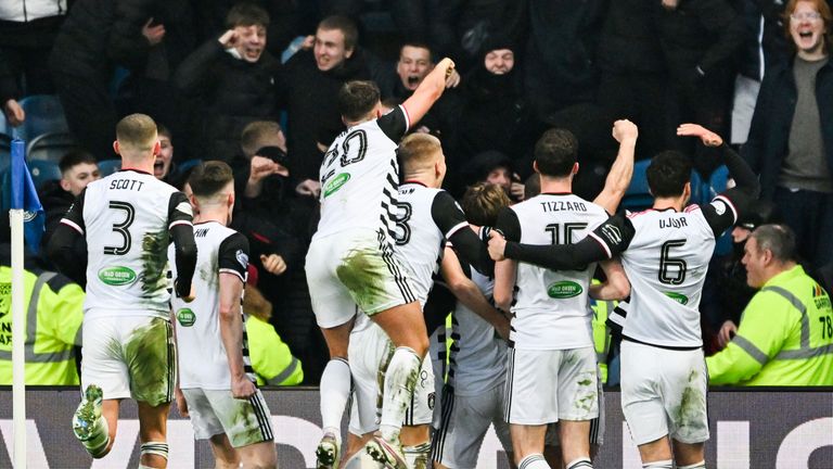 GLASGOW, SCOTLAND - FEBRUARY 09: Queen's Park players celebrates after Seb Drozd scores to make it 1-0 during a Scottish Gas Men's Scottish Cup match between Rangers and Queen's Park at Ibrox Stadium, on February 09, 2025, in Glasgow, Scotland. 