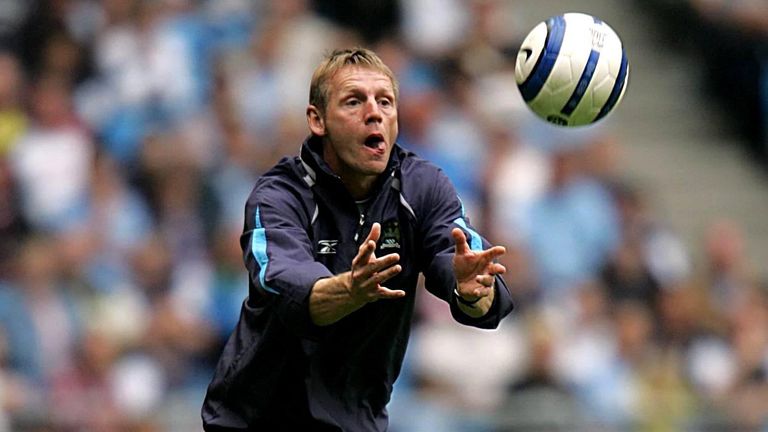 Manchester City manager Stuart Pearce tosses the ball back into play