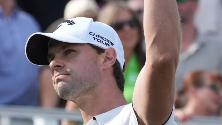 Thomas Detry, of Belgium, waves to the cheering crowd after hitting his tee shot close to the pin on the 16th hole during the final round of the Phoenix Open golf tournament at TPC Scottsdale, Sunday, Feb. 9, 2025, in Scottsdale, Ariz. (AP Photo/Ross D. Franklin)