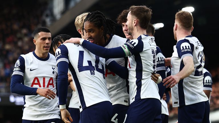 Djed Spence celebrates Spurs' third goal