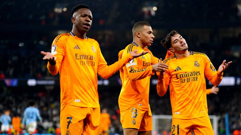 Vinicius celebrates with Real Madrid players