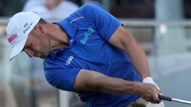 Wyndham Clark hits his tee shot at the 16th hole during the first round of the Waste Management Phoenix Open PGA Tour golf tournament at the TPC Scottsdale Thursday, Feb. 6, 2025, in Scottsdale, Ariz. (AP Photo/Ross D. Franklin) 