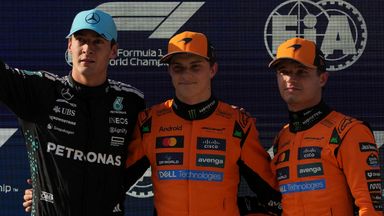 McLaren driver Oscar Piastri of Australia is flanked with Mercedes driver George Russell of Britain, left, and McLaren driver Lando Norris of Britain, right, after qualifying session for the Chinese Grand Prix at the Shanghai International