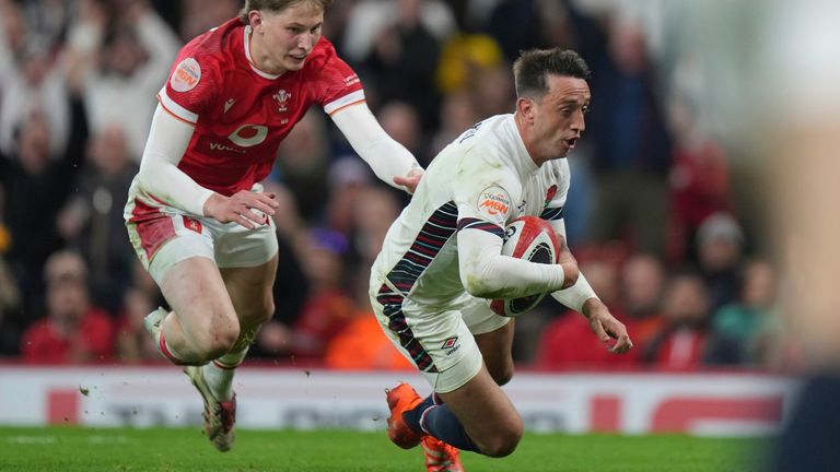 England's Alex Mitchell, right, goes over to score a try during the Six Nations rugby union match between Wales and England at the Principality Stadium in Cardiff, Wales, Saturday, March 15, 2025. (AP Photo/Alastair Grant)