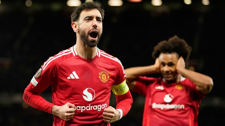 Manchester United's Bruno Fernandez celebrates his first goal for the side in a Europa League football match between Manchester United and Real Sociedad at Old Trafford Stadium in Manchester, England on Thursday, March 13, 2025. (AP Photo/Dave Thompson)