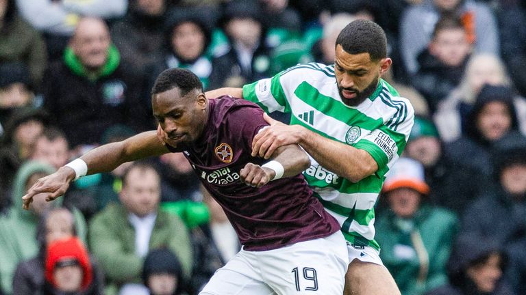 GLASGOW, SCOTLAND - MARCH 29: Hearts' Elton Kabangu (L) and Celtic's Cameron Carter-Vickers in action during a William Hill Premiership match between Celtic and Heart of Midlothian at Celtic Park, on March 29, 2025, in Glasgow, Celtic (Photo by Craig Foy / SNS Group)